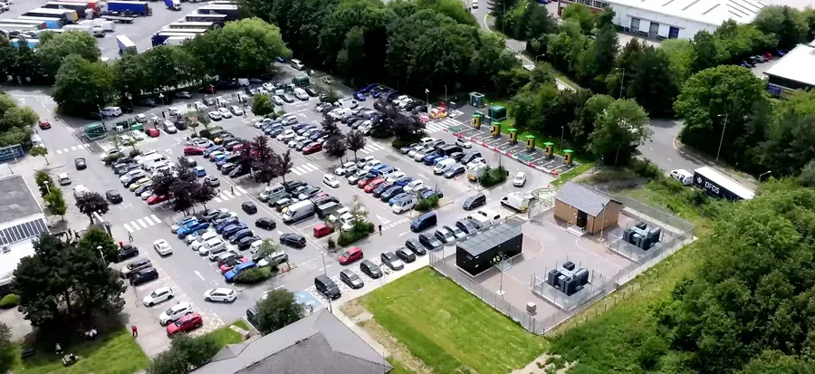 Aerial view of a car park with a completed EV charging installation and substation