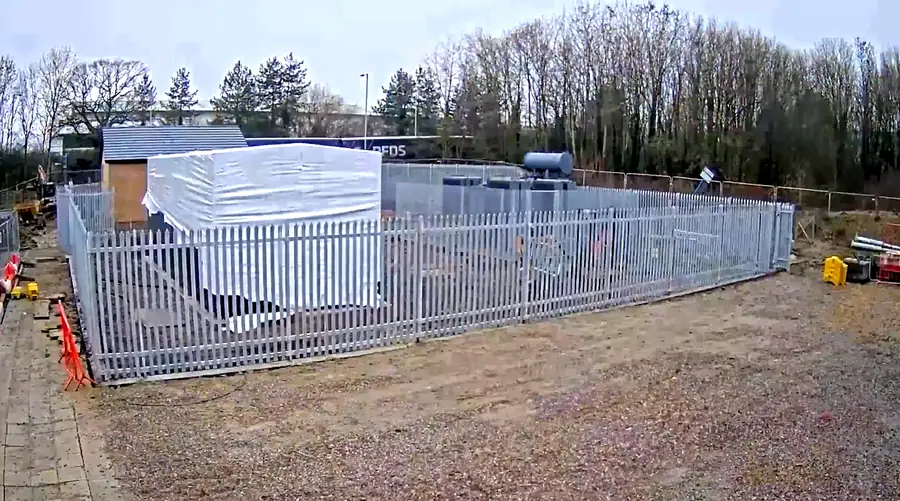 Completed ground-mounted substation enclosed within palisade security fencing